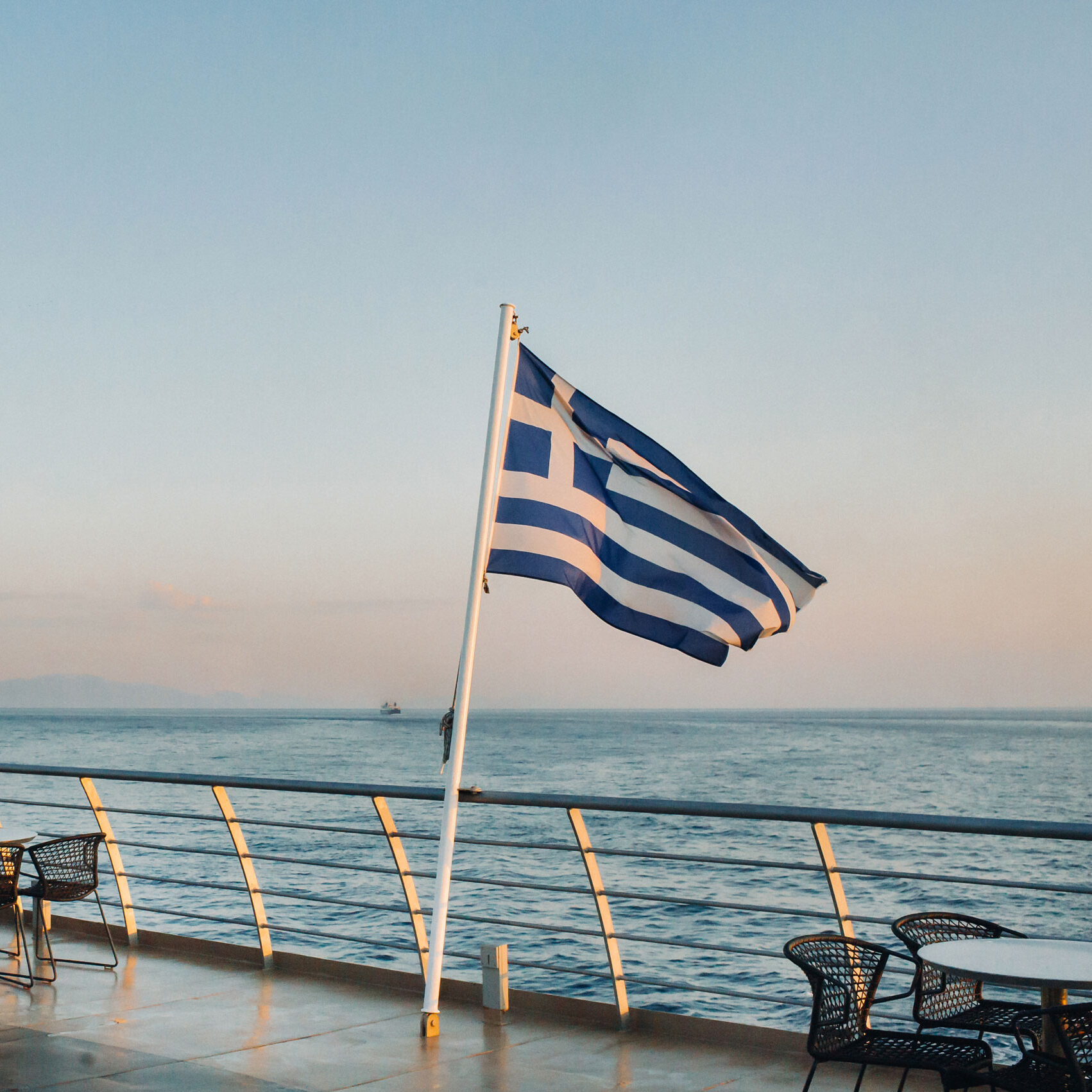Large Ferry at dawn in the Mediterranean Sea with a Greece flag on board for Greece Grade 9 & 10 academic program
